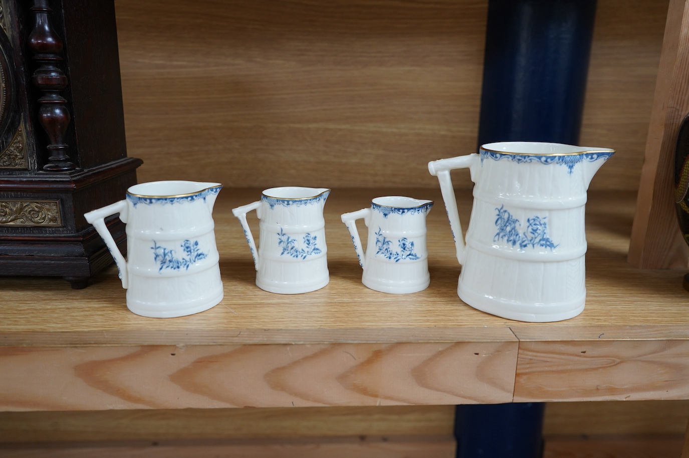 A graduated set of four Royal Worcester blue and white jugs, tallest 11cm. Condition - good.